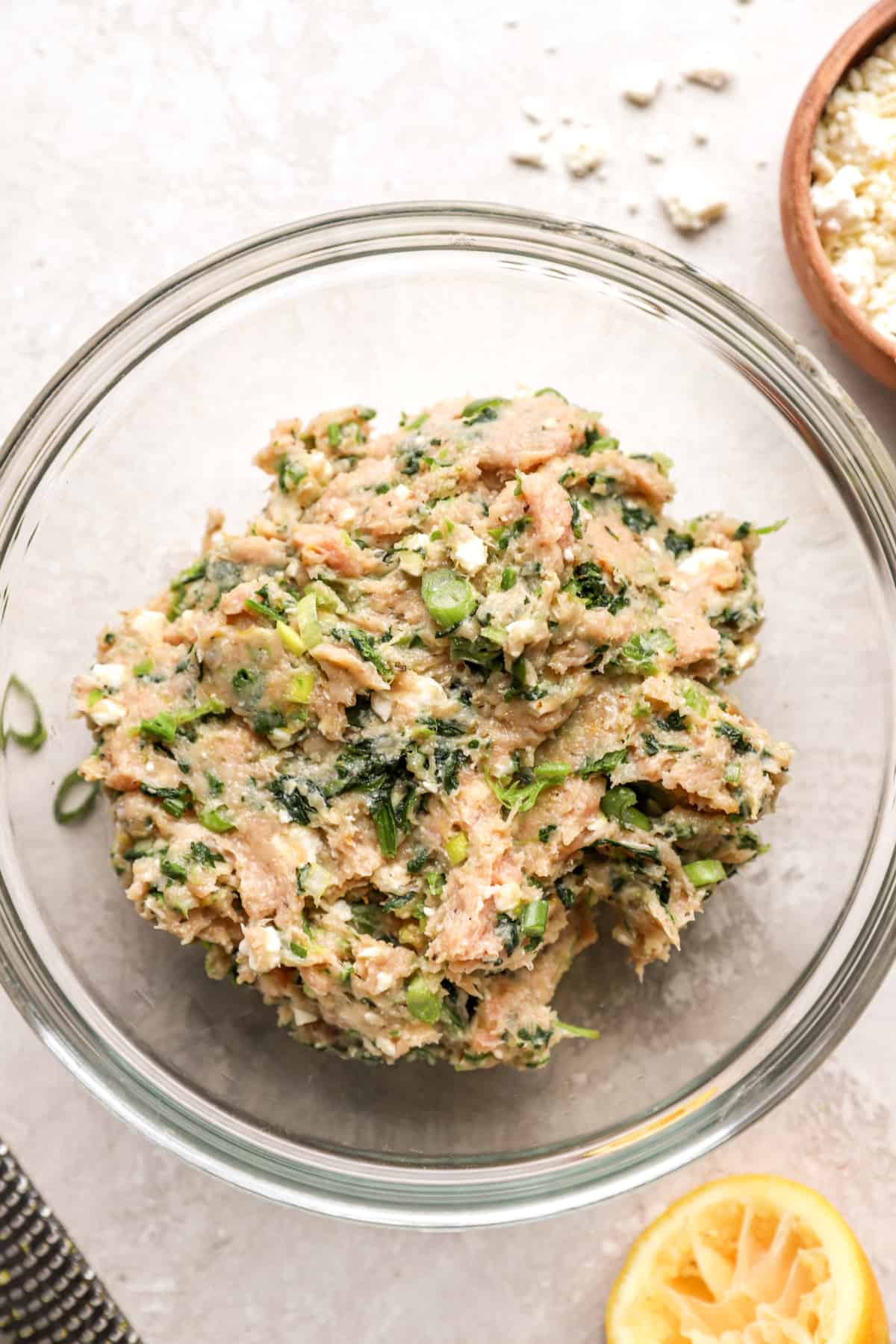 above image of a bowl with ground chicken, spinach, and spices.